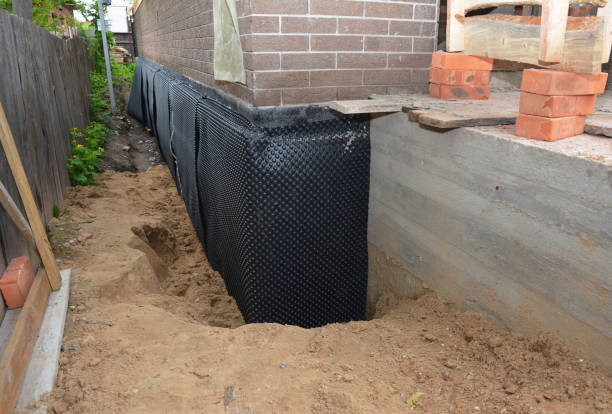 Happy homeowners after waterproofing job in Columbia
